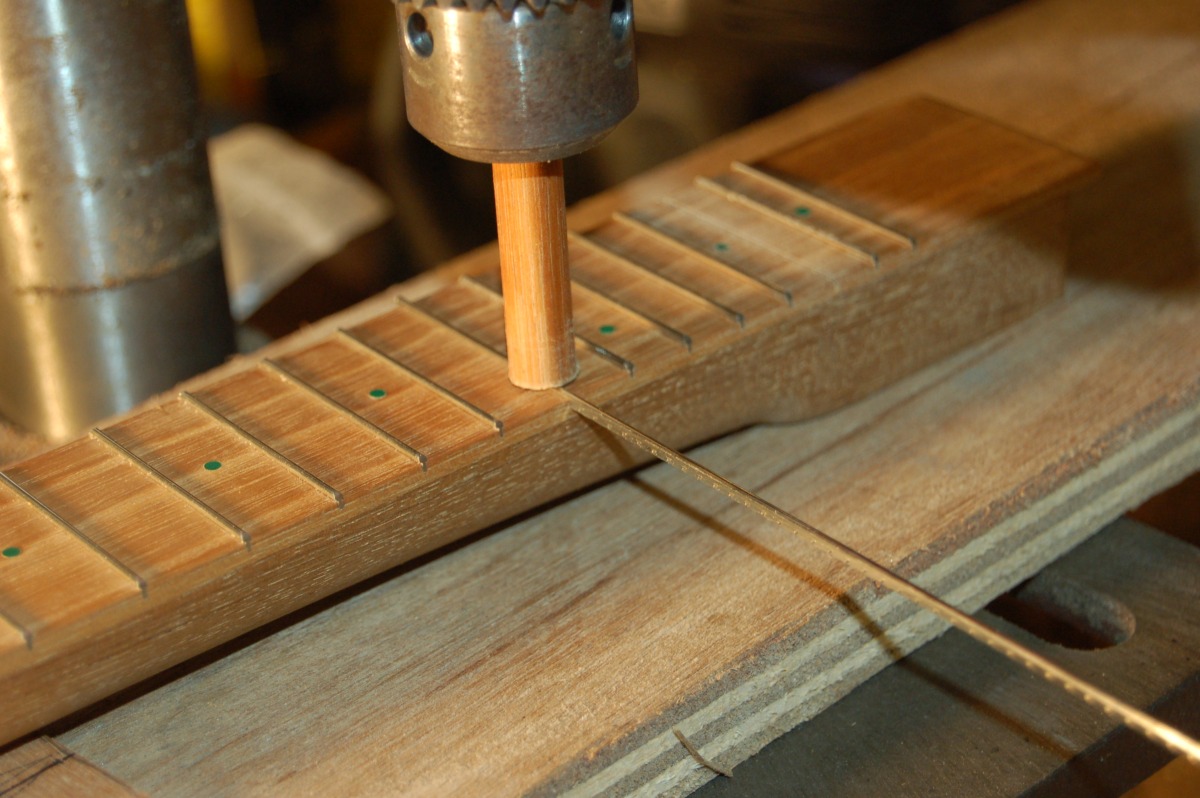 pressing fret wire into place with a drill press