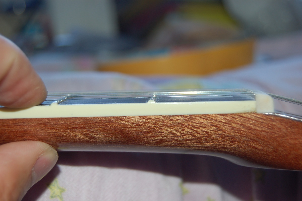 showing string clearance over the first fret.