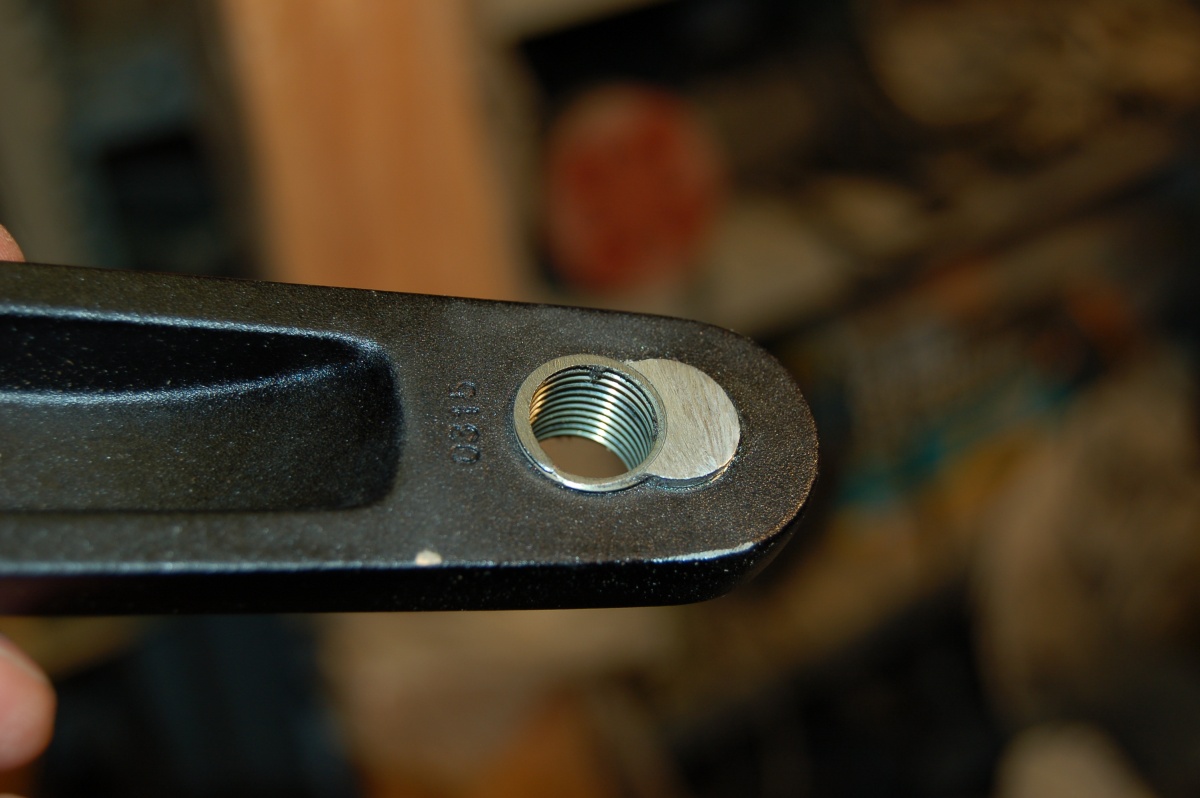 excess trimmed of insert on inner face of crank